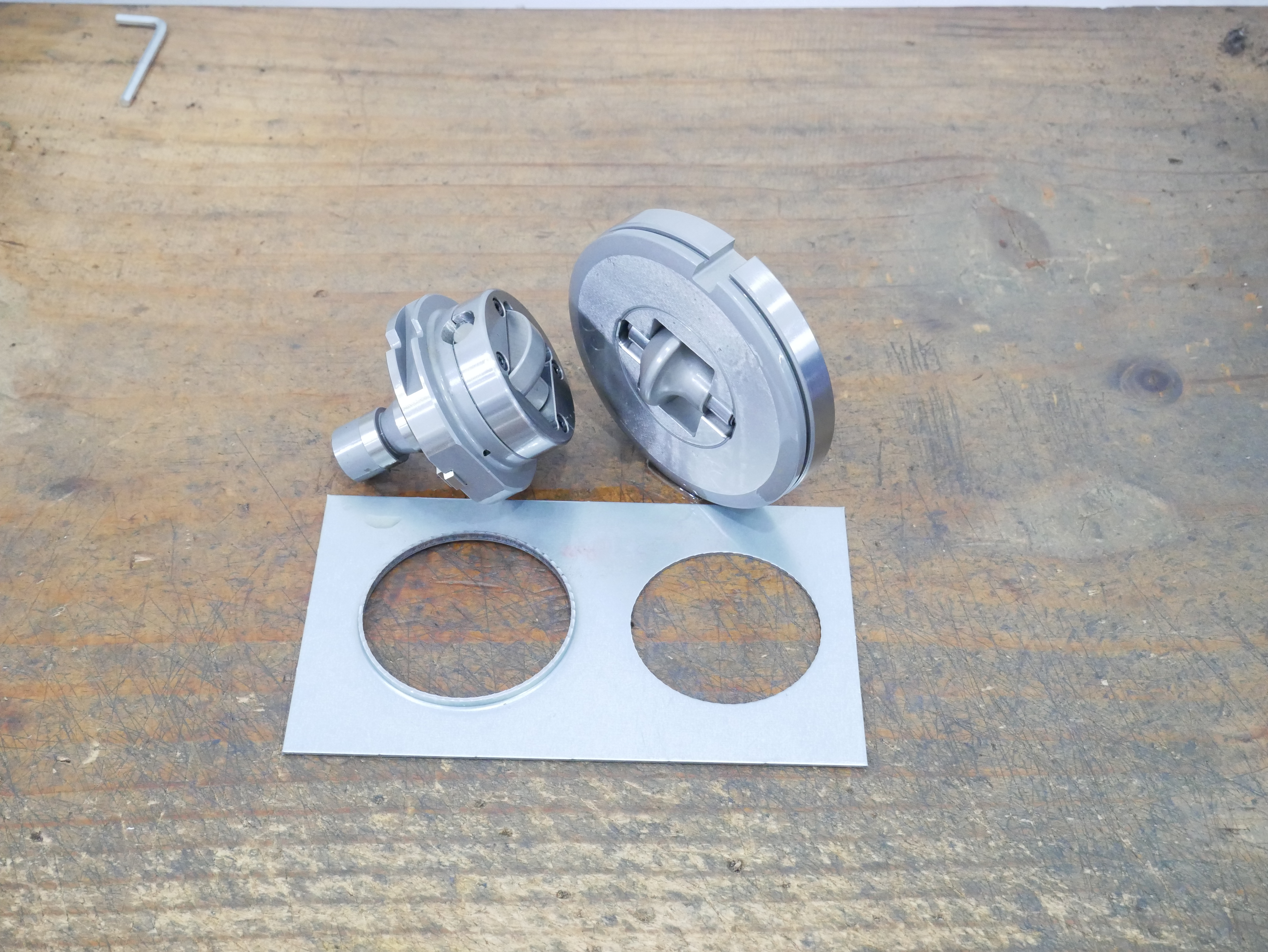 Trumpf-style rolling flare wheel tool assembly and scratch-free flared circular openings on sheet metal